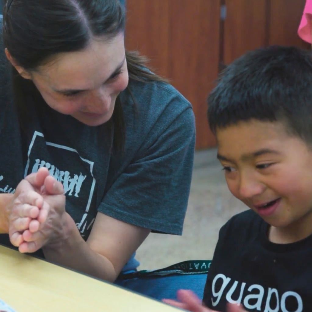 Teacher works with special education student